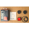 Image of the Magene L308 tail light featuring a red light, a red button, and a black button on a seatpost mount.