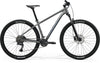 Side view of a Merida BIG.NINE 300 hardtail mountain bike with front suspension, Grey Frame and Maxxis tires.