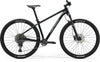 A black Merida BIG.NINE 400 hardtail mountain bike.