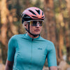 Cyclist wearing Magicshine Rouler Photochromic Sports Sunglasses-Lake Blue during an outdoor ride, demonstrating seamless adaptability to changing light conditions.