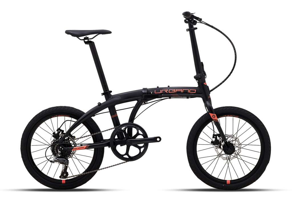 A black Magicshine ALLTY 1200U bike light is mounted underneath a bicycle handlebar, positioned directly below a Garmin cycling computer, creating a streamlined integrated setup.