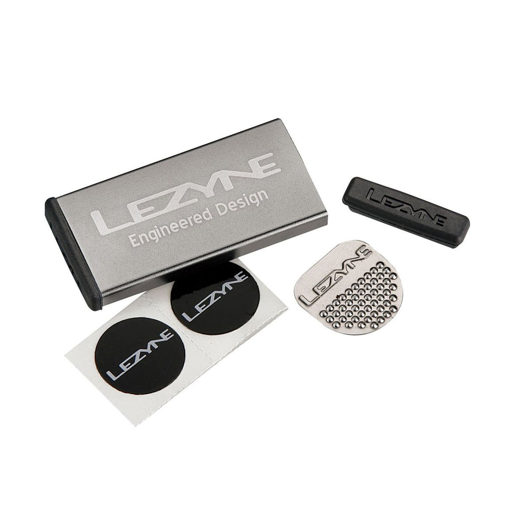 Compact waterproof cycling patch kit with aluminum case