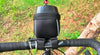 Cyclist using the touch-sensitive screen of a mobile phone inside the Trek N Ride Handlebar Bag during a ride.