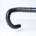 BTP Faux Leather Bartape in Andiamo Black wrapped on a road bike handlebar, front view.