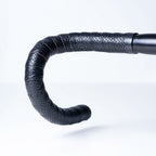 BTP Faux Leather Bartape in Andiamo Black wrapped on a road bike handlebar, front view.