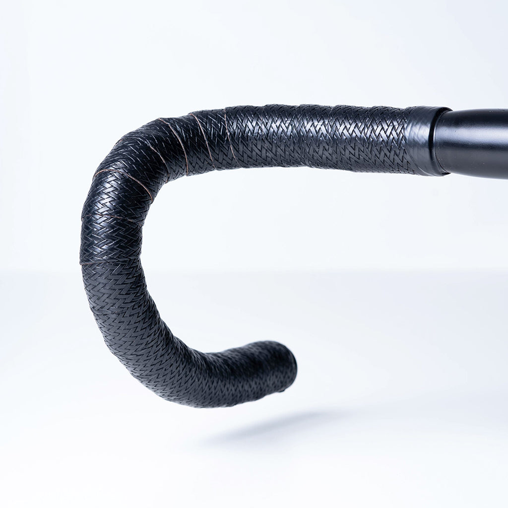 BTP Faux Leather Bartape in Andiamo Black wrapped on a road bike handlebar, front view.