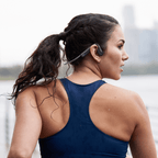 Shokz OpenMove Grey headphones shown with retail packaging and accessories.