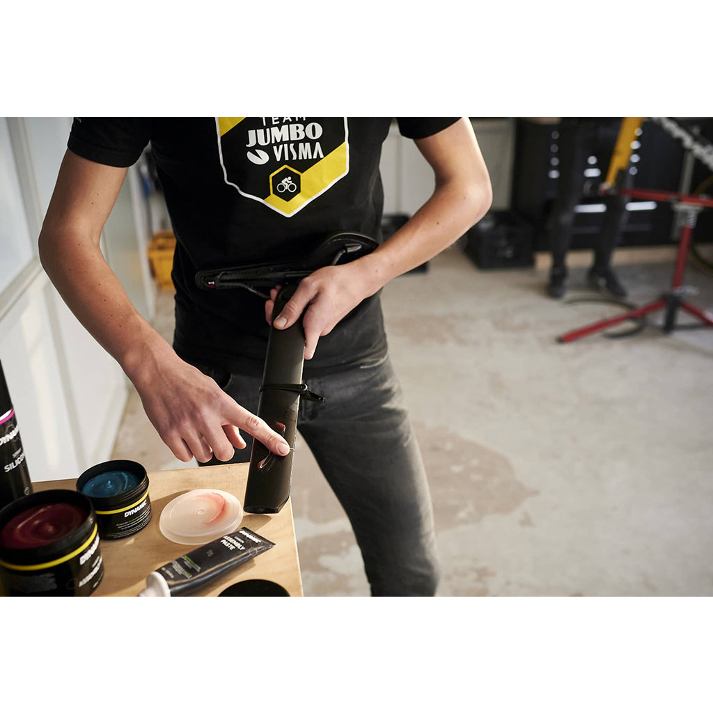 Close-up of Dynamic Carbon Assembly Paste 5gm packet, highlighting its specialized formula to prevent slippage and creaking on carbon bike parts.