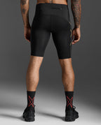 Rear view of the 2XU Light Speed Compression Shorts in Black/Gold Reflective showing the waistband zip pocket.