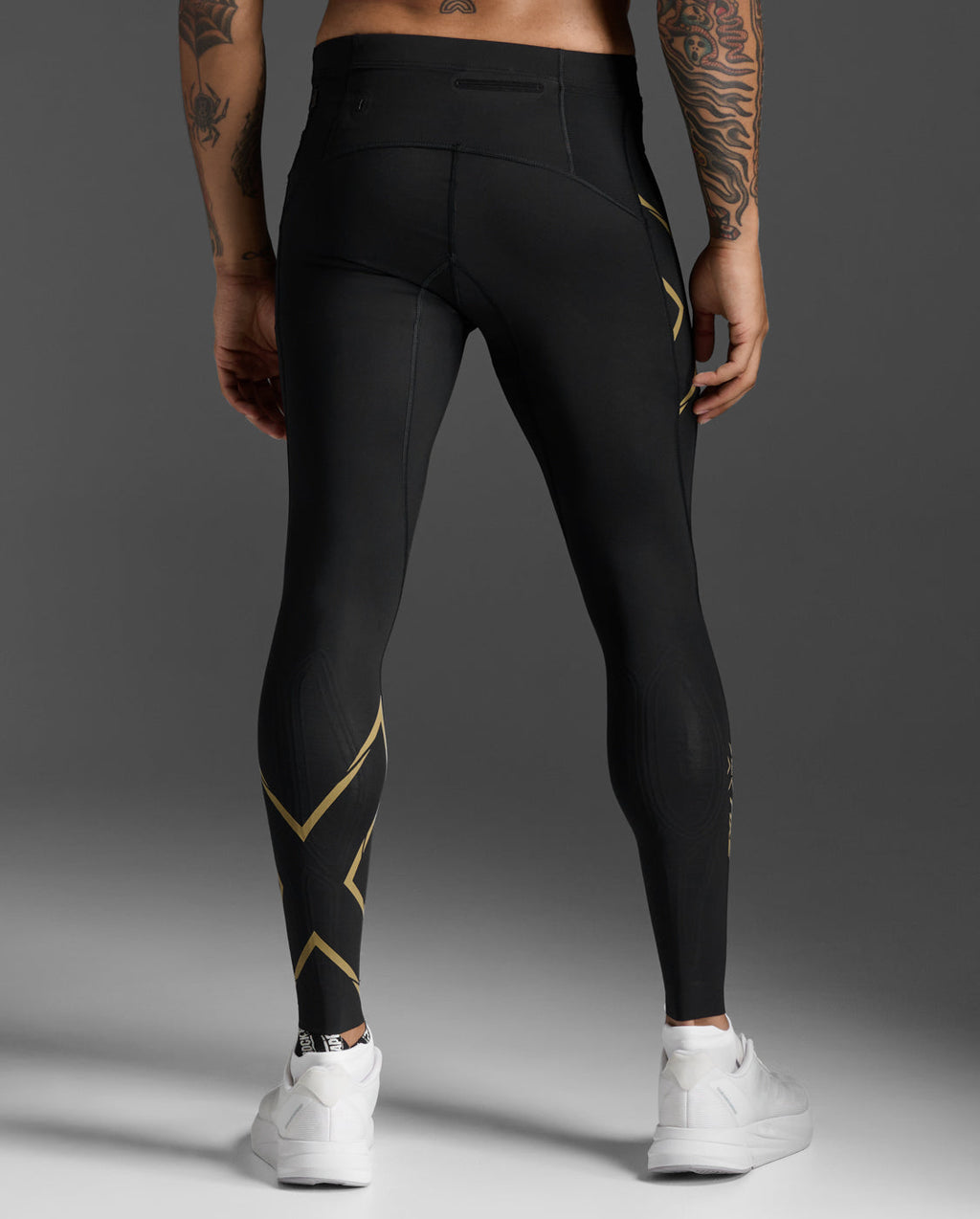 Rear view of the 2XU Light Speed Compression Tights showing the waistband pocket and gold reflective calf trim.
