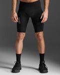 2XU Light Speed React Compression Shorts in Black/White Reflective, front view showing the 2XU thigh logo.