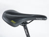 Close-up of a bicycle seat featuring the word "schweizer," with a red and black design by Author, model Bicycle Vertigo 18