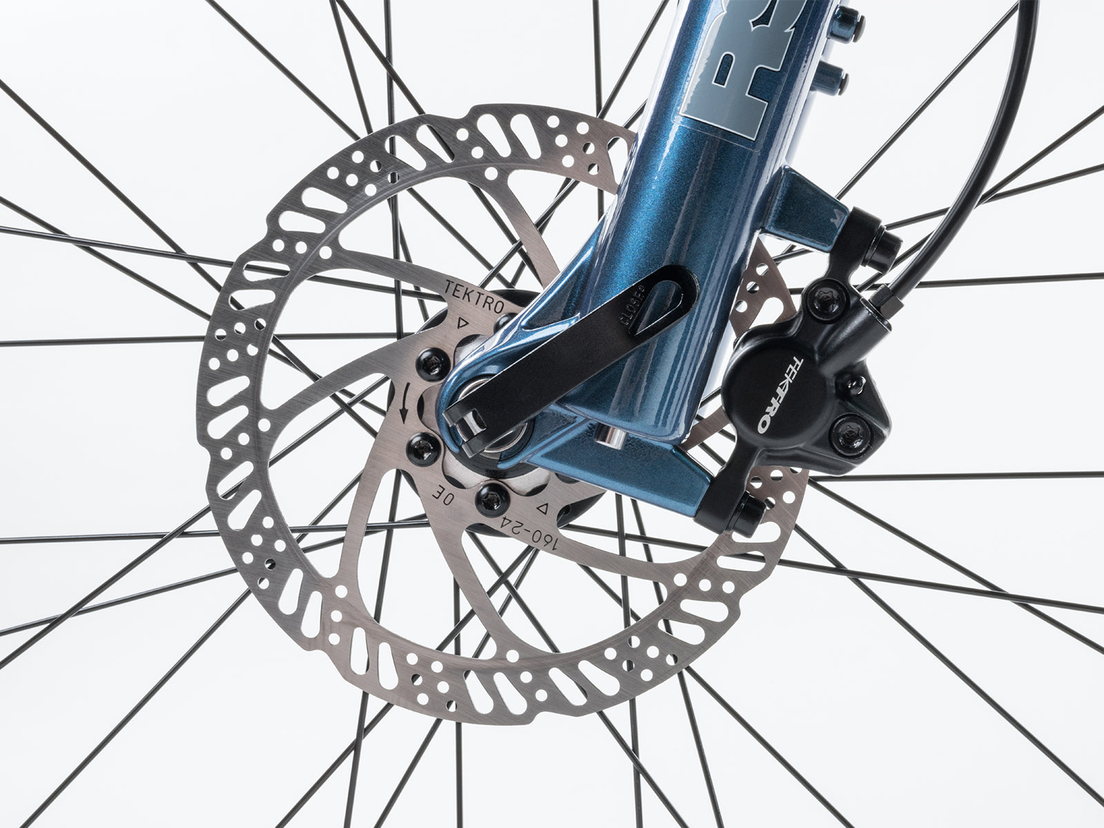  Rear disc brake on a mountain bike, featuring a red and black design, showcasing the brand Bicycle Vertigo.
