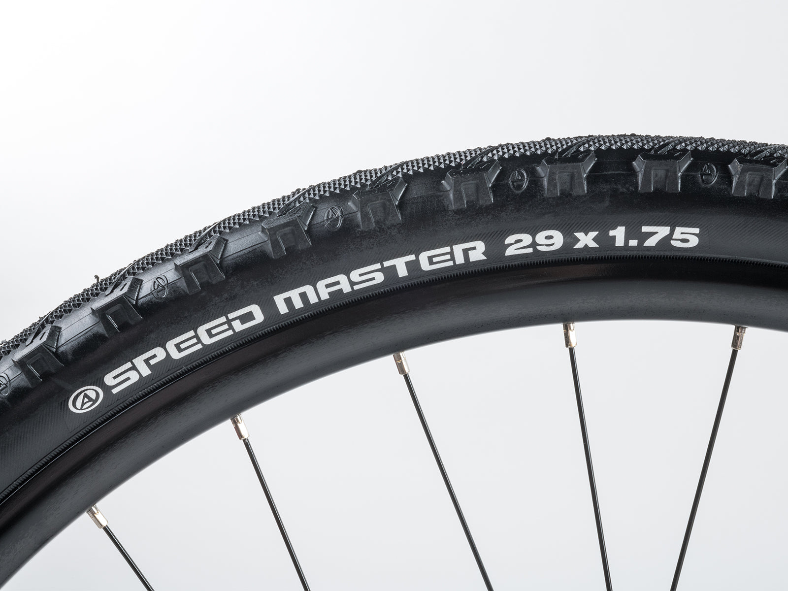  Close-up of the rear derailleur attached to the rear wheel of a red and black Author Vertigo 18 bicycle.