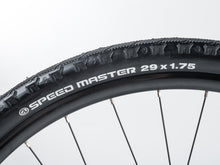  Close-up of the rear derailleur attached to the rear wheel of a red and black Author Vertigo 18 bicycle.