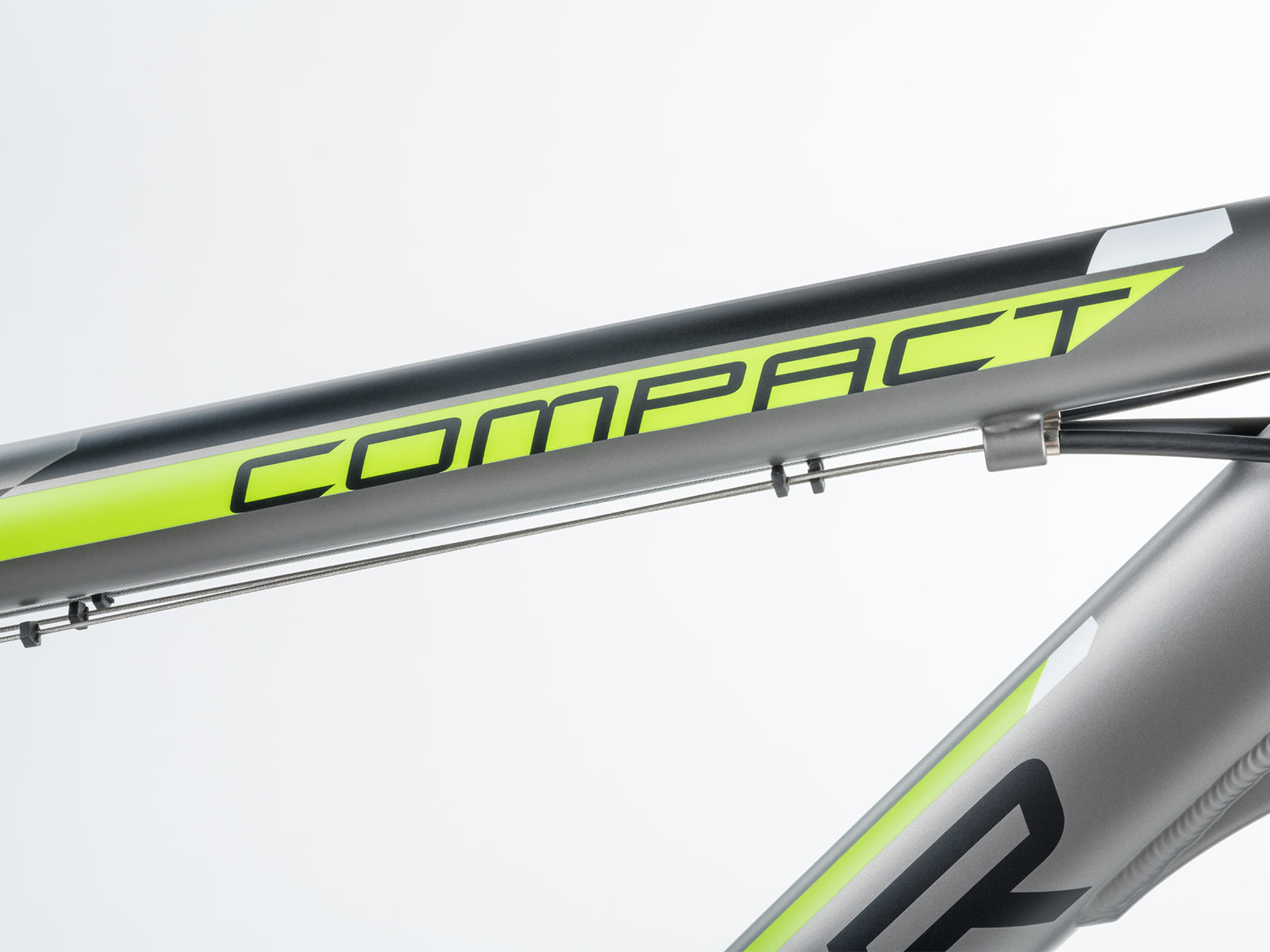 1. Close-up of a  bike featuring the word compact on its frame, showcasing its sleek design and style.
