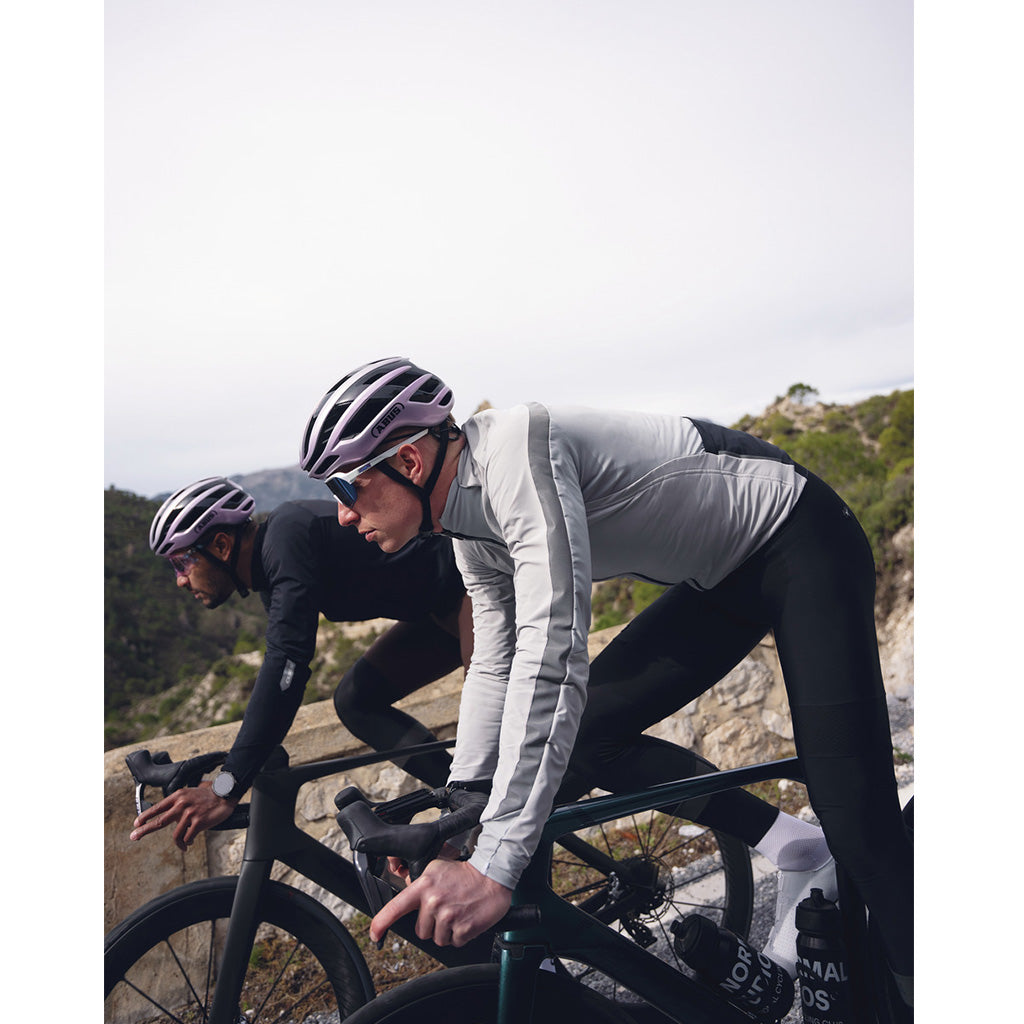 Professional-level aero road bike helmet by Abus in glossy purple, designed in Italy for competitive cycling.

