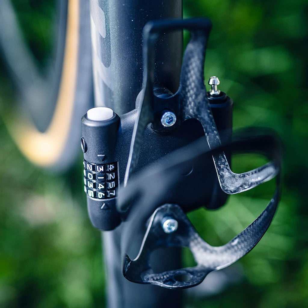 Lightweight Abus bike lock mounted under bottle holder for short stops.

