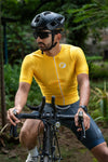 Cyclist man wearing Yellow Aurelius Cycling Jersey