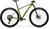 Side view of a green Merida Big Nine 7000 hardtail mountain bike with black Maxxis tires.