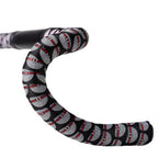 Angled close-up of the bar tape’s detailed woven pattern, ensuring vibration absorption and a sleek look.