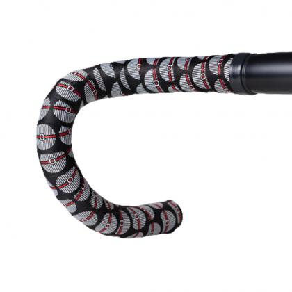 Side view of BTP Woven Bar Tape - Coin White applied to a bike handlebar, offering a secure grip for long rides.