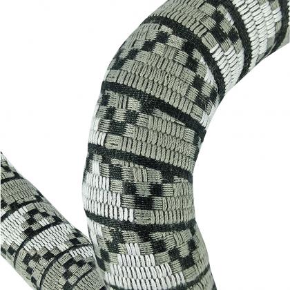 A black and white snake coils around a white object, showcasing the BTP Woven bicycle Bar tape in Jungle Grey
