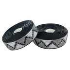 Two rolls of bicycle bar tape and white striped tape on a clean white background, BTP WOVEN BARTAPE-JUNGLE GREY
