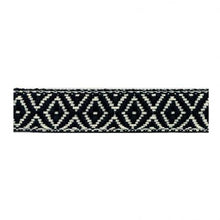 Close-up of a black and white bicycle  btp bartape in diamond-patterned bartape