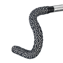  Black and white bicycle handlebar featuring a diamond-patterned BTP woven bartape