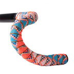  Close-up of a bicycle handle bar adorned with bright, jungle summer patterned tape, showcasing its colorful designs