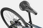 Cannondale Quick CX 3 Tungsten Blue hybrid bike on gravel trail
