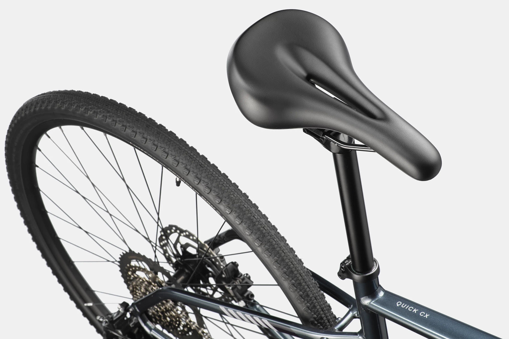 Cannondale Quick CX 3 Tungsten Blue hybrid bike on gravel trail