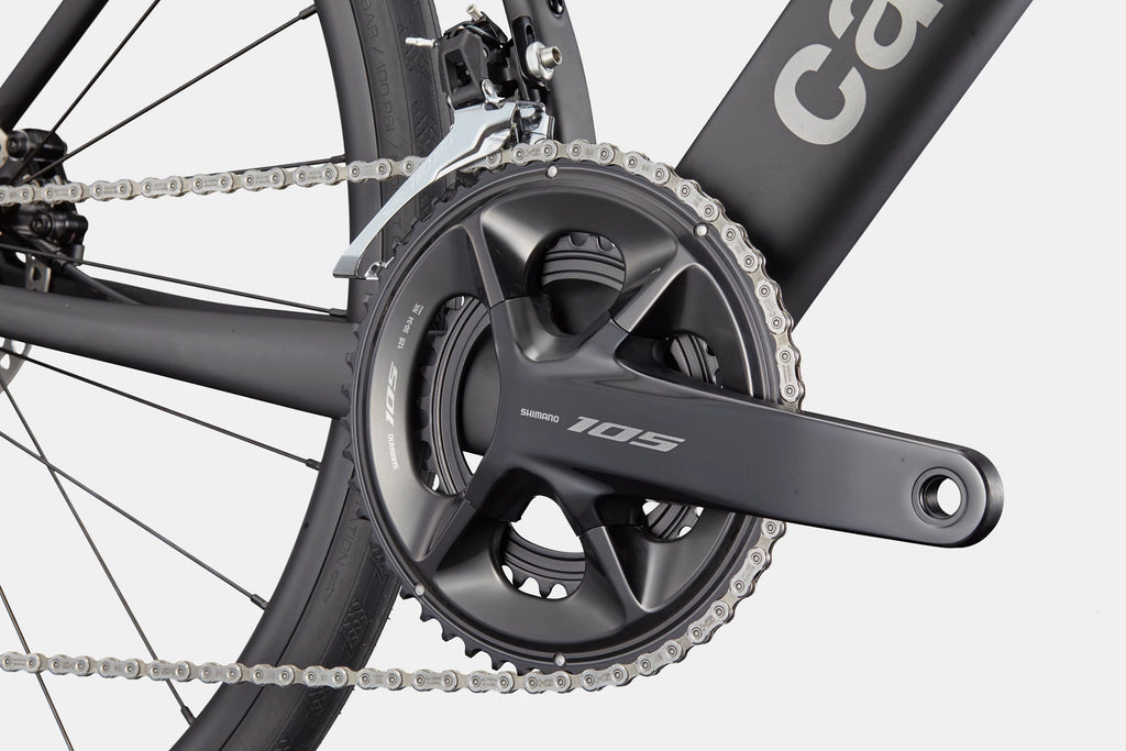 Close-up of the Cannondale Synapse Carbon 5's drivetrain, highlighting the Shimano 105 crankset and front derailleur.