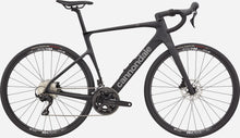 Full view of the black Cannondale Synapse Carbon 5 endurance road bike, highlighting its sleek carbon frame design.