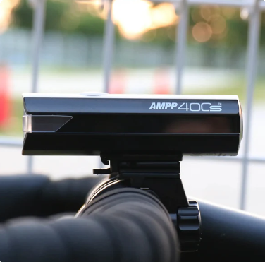 Side view of the Cateye AMPP 400 S, showing the compact design and power button.