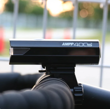 Side view of the Cateye AMPP 400 S, showing the compact design and power button.