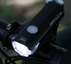 Cateye AMPP 400 S in action, illuminating a dark road.