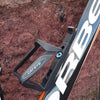 Cateye BC-300 bottle cage, showing the mounting bolts and installation.