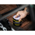 Dynamic Assembly Paste Pro being applied to a carbon seatpost

