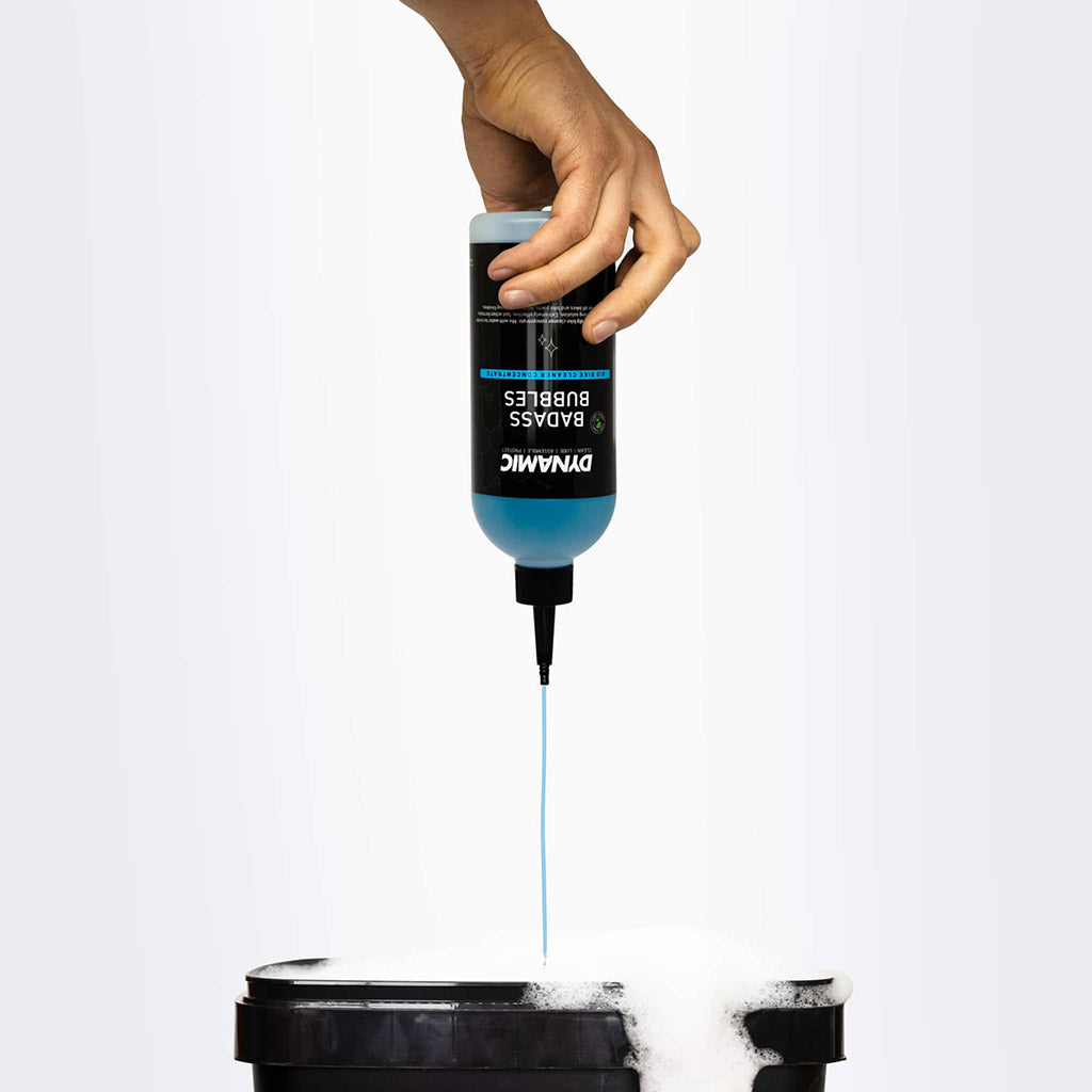 Close-up of Dynamic Badass Bubbles bottle, highlighting bio-friendly label