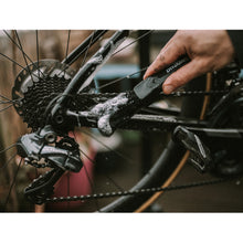 The brush features two flexible arms with tough nylon bristles for effective cleaning in tight spaces.