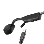 Shokz OpenMove Grey bone conduction headphones with USB-C charging cable.