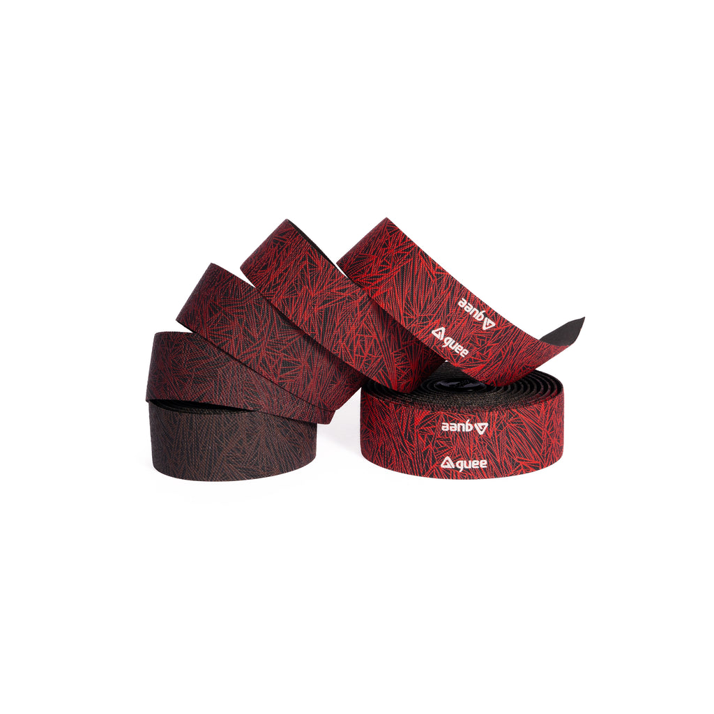 Close-up of GUEE Attitude Fade Red bicycle bar tape, highlighting its vibrant color fade and stylish, modern aesthetic.