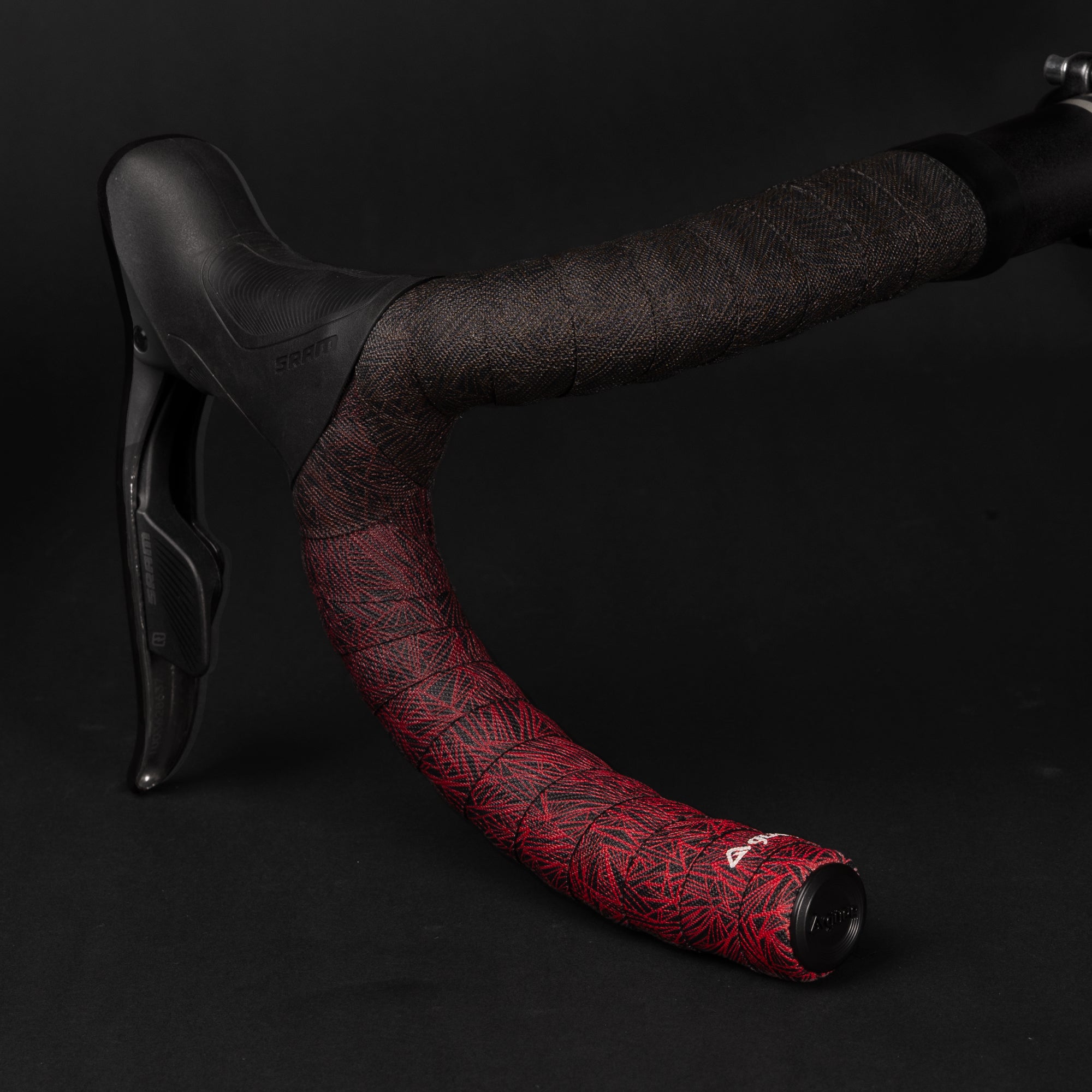 GUEE Attitude Fade Red bar tape, featuring a distinctive gradient pattern for a high-performance and stylish bike upgrade.