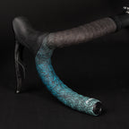  GUEE Attitude Fade Celeste Bar Tape Close-up of GUEE Attitude Fade Celeste bicycle handlebar tape, showing the gradient color transition from light blue to a creamy white.