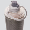 Top-down view of Hydrapak 1.5L bottle with open nozzle  ready for quick hydration during trail running

