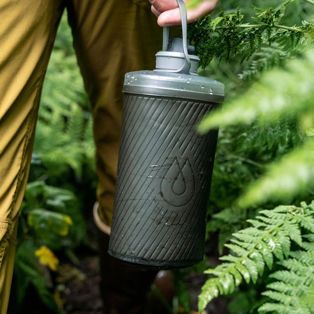 Hydrapak Flux 1L Mammoth Grey bottle shown in trail running gear setup

