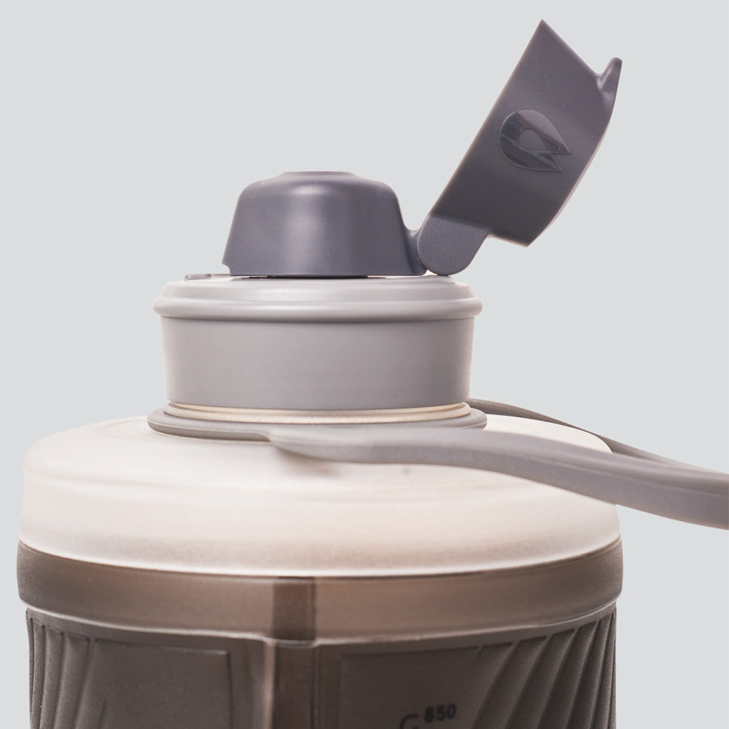 Hydrapak 750ml bottle clipped to hiking backpack adventure-ready hydration.


