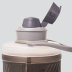 Hydrapak 750ml bottle clipped to hiking backpack adventure-ready hydration.


